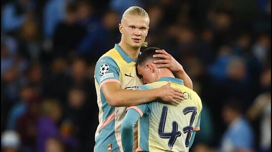 Erling Haaland y Phil Foden. (REUTERS)